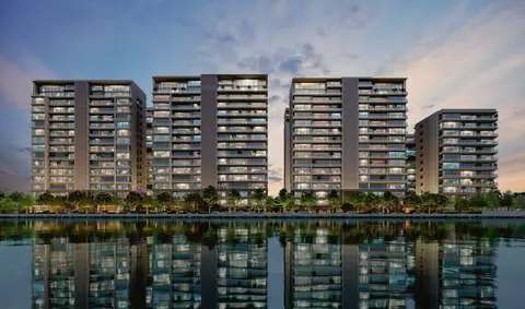 Avadh Classima towers reflected in the Tapi river at dusk